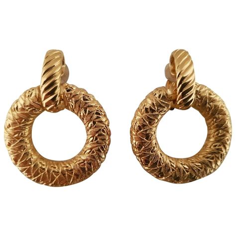 yves saint laurent gold earrings.